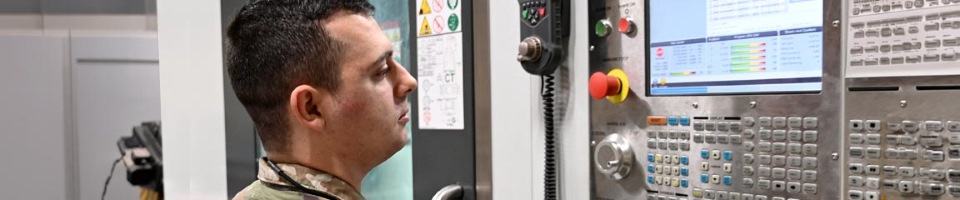Inputs data to manufacture aircraft parts at Dyess Air Force Base, Texas