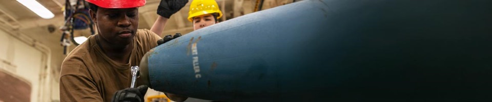 USS Tripoli Sailors Assemble Ordnance 
